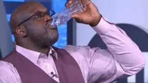 Shaq Holding a water Bottles